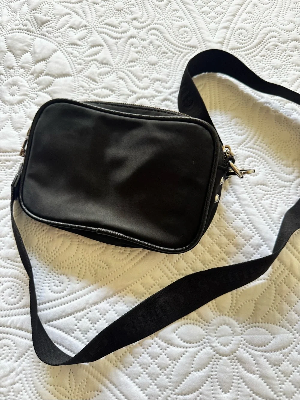 GUESS Black Crossbody Bag with Silver Logo Plate